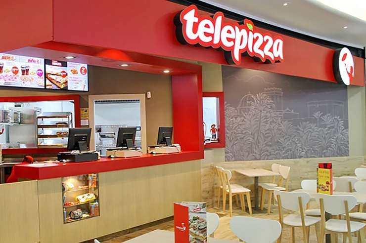 Interior d'un local de Telepizza.